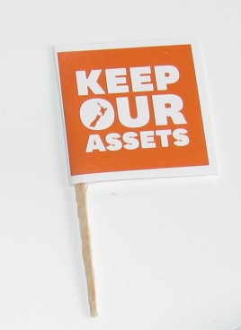 Keep Our Assets flyers recycled into little flags to keep the movement alive